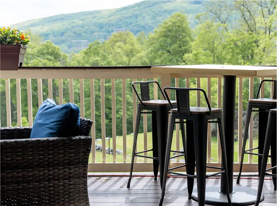 Outdoor patio at Hef's Hut with inviting decor, string lights, and comfortable seating, creating a warm and relaxed dining atmosphere.
