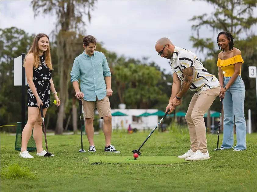 A group of friends enjoying their weekend at 1Club, playing park golf and having fun in the sun.