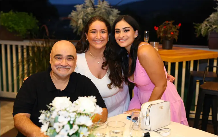 Guests celebrating a wedding on the patio at Hef's Hut in Vernon, NJ, surrounded by festive decorations, lights, and an outdoor dining setup.