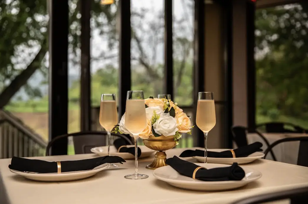 Elegant table setup with champagne glasses for a private event at Hef's Hut in Vernon, NJ.
