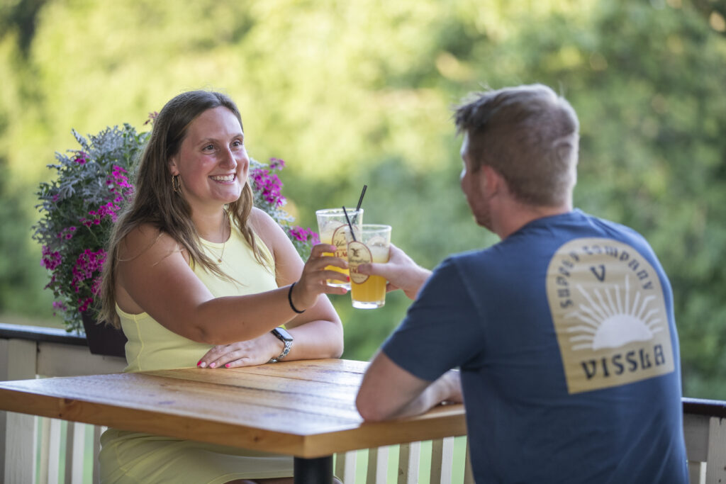 Couple on a NJ date at Hef's Hut, on the patio.