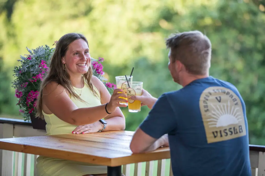Couple on a NJ date at Hef's Hut, on the patio.